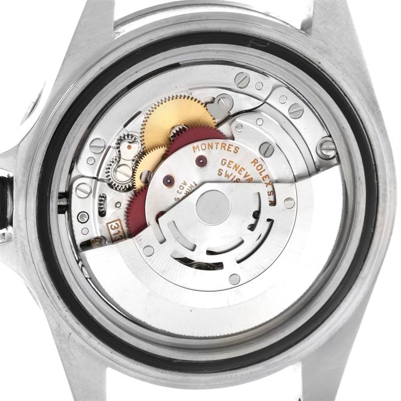 The image shows the rear view of a Rolex Submariner 14060 Men
s Stainless Steel Black Dial 14060 Men
s Stainless Steel Black Dial, highlighting its intricate internal movement mechanisms.