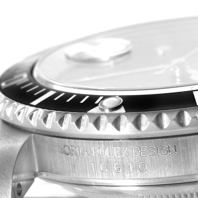 The image shows a close-up view of the bezel, crystal, and side case of a Rolex Submariner 16610 Men's Stainless Steel Black Dial 16610 Men's Stainless Steel Black Dial watch.