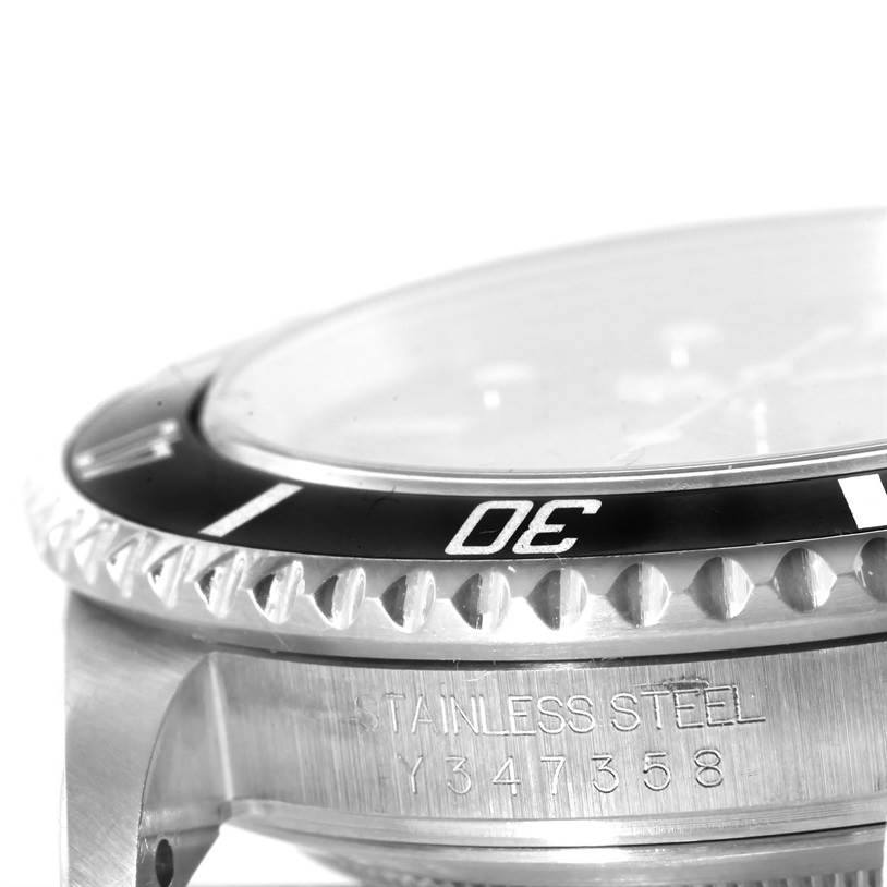 The image shows a close-up side angle of the bezel, crystal, and case of a Rolex Submariner 16610 Men's Stainless Steel Black Dial 16610 Men's Stainless Steel Black Dial watch, highlighting its stainless steel construction.