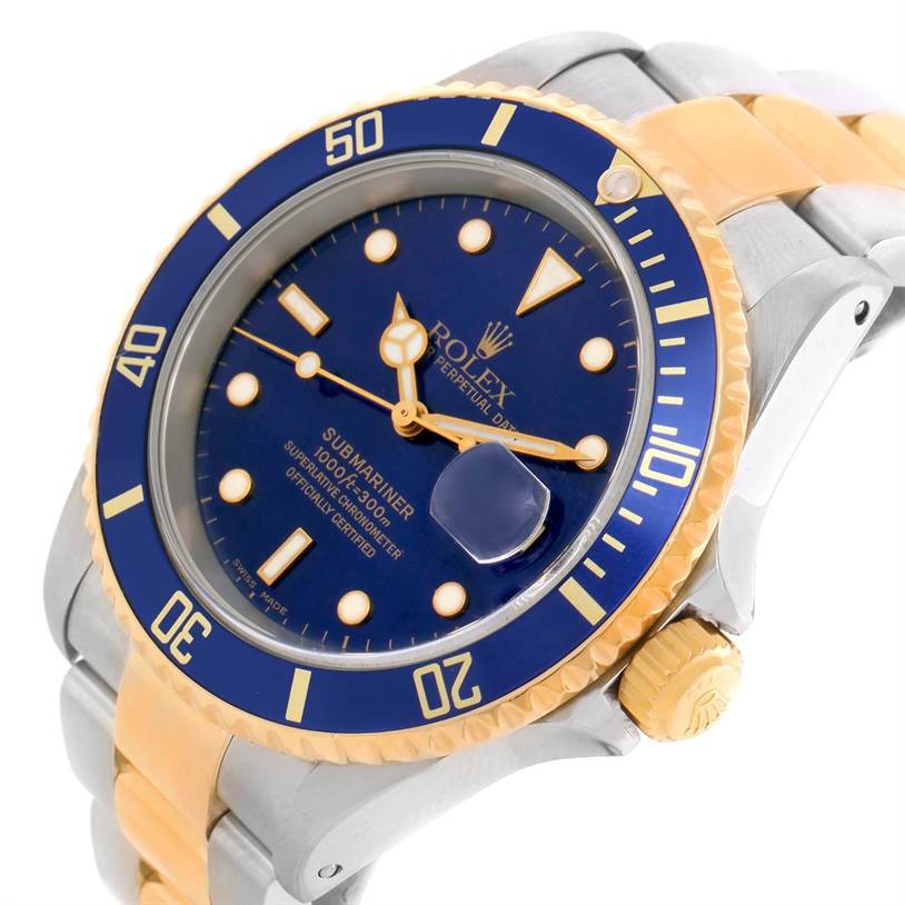 The image shows a Rolex Submariner 16613 Men's Steel and Gold (two tone) Blue Dial 16613 Men's Steel and Gold (two tone) Blue Dial watch from a close-up angle, highlighting the bezel, dial, crown, and part of the bracelet.