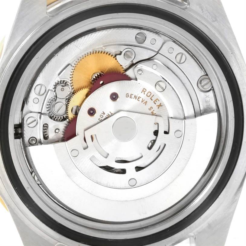 This image shows the internal mechanical movement of a Rolex Submariner 16613 Men's Steel and Gold (two tone) Blue Dial 16613 Men's Steel and Gold (two tone) Blue Dial watch from a rear angle.