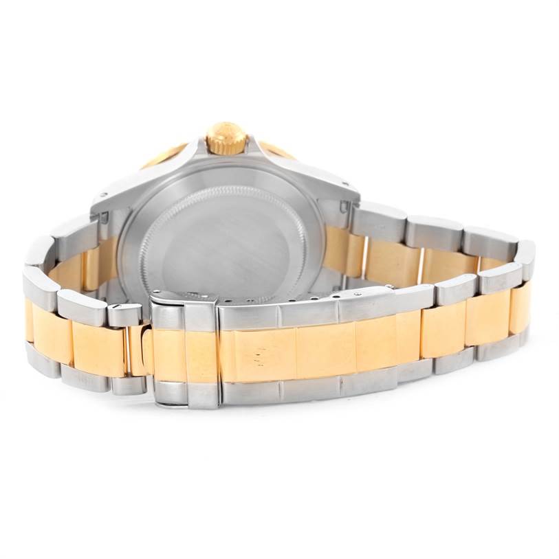 This image shows the back of a Rolex Submariner 16613 Men's Steel and Gold (two tone) Blue Dial 16613 Men's Steel and Gold (two tone) Blue Dial watch with a two-tone stainless steel and gold bracelet.