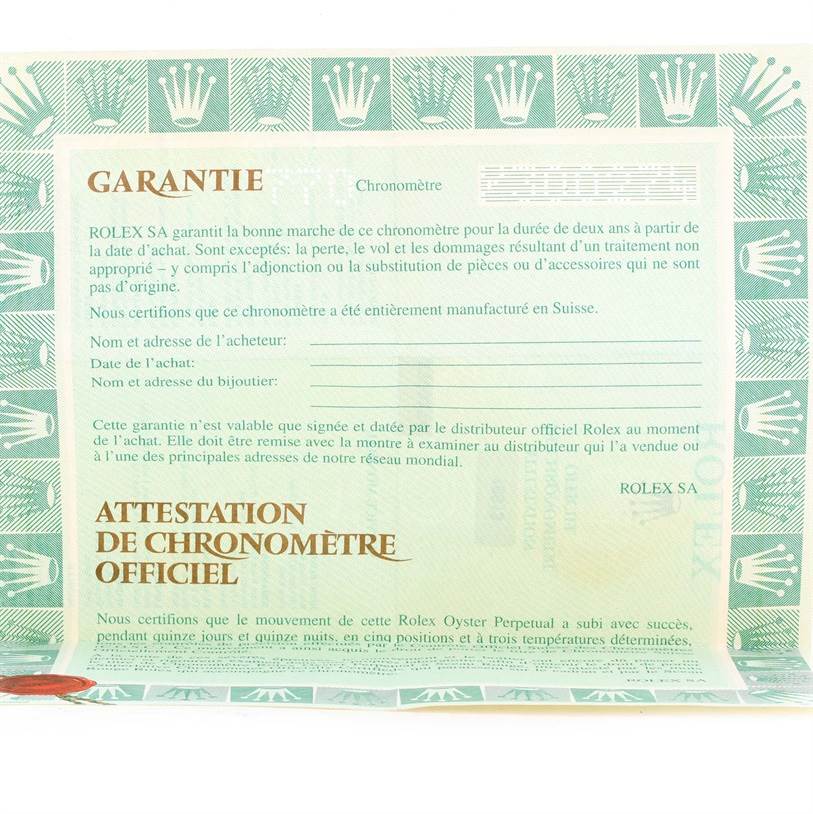 This image shows a warranty and chronometer certificate for a Rolex Submariner 16613 Men's Steel and Gold (two tone) Blue Dial 16613 Men's Steel and Gold (two tone) Blue Dial watch.