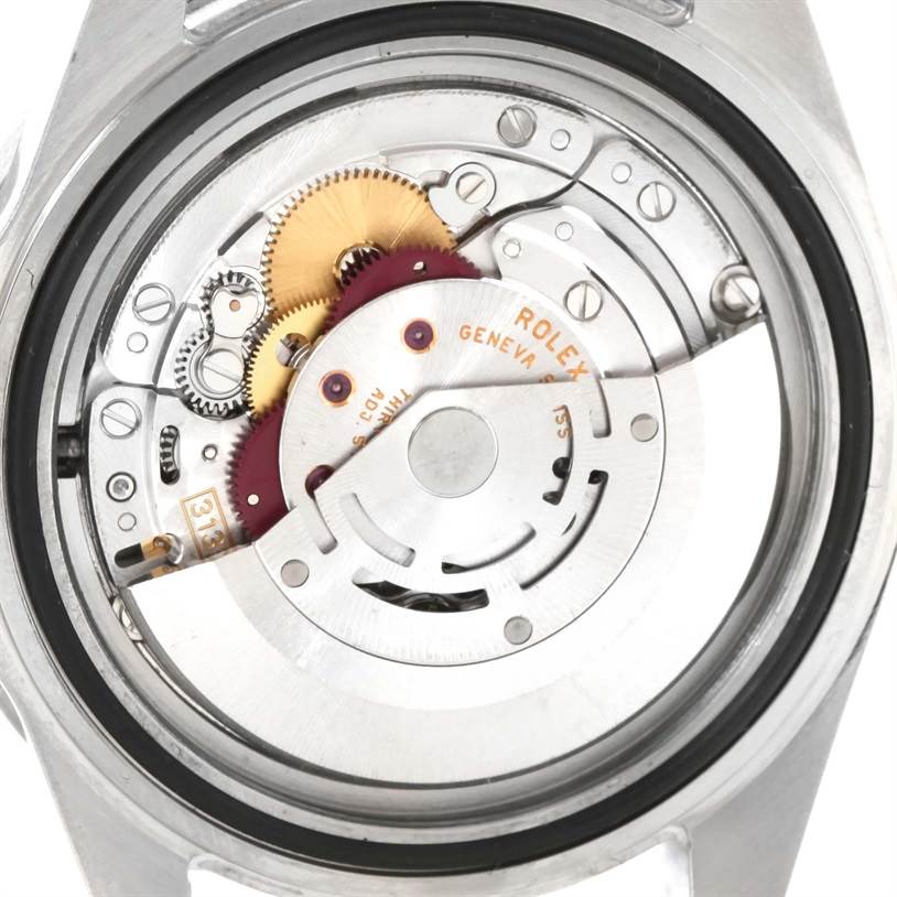 The image shows an up-close view of the internal movement and components of a Rolex Submariner 16610 Men
s Stainless Steel Black Dial 16610 Men
s Stainless Steel Black Dial watch.