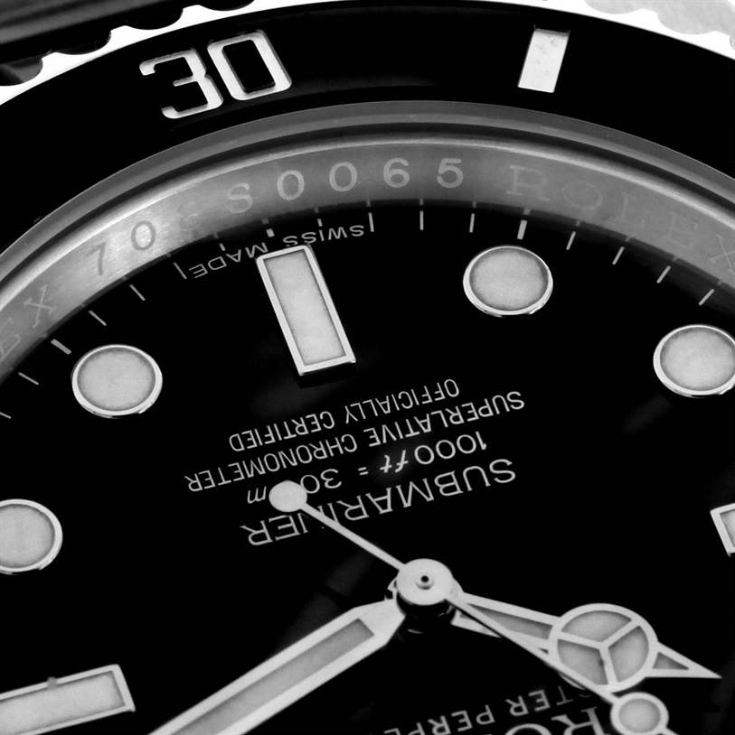 This close-up angle shows the dial, hands, and part of the bezel of the Rolex Submariner 114060 Men
s Stainless Steel Black Dial 114060 Men
s Stainless Steel Black Dial watch.