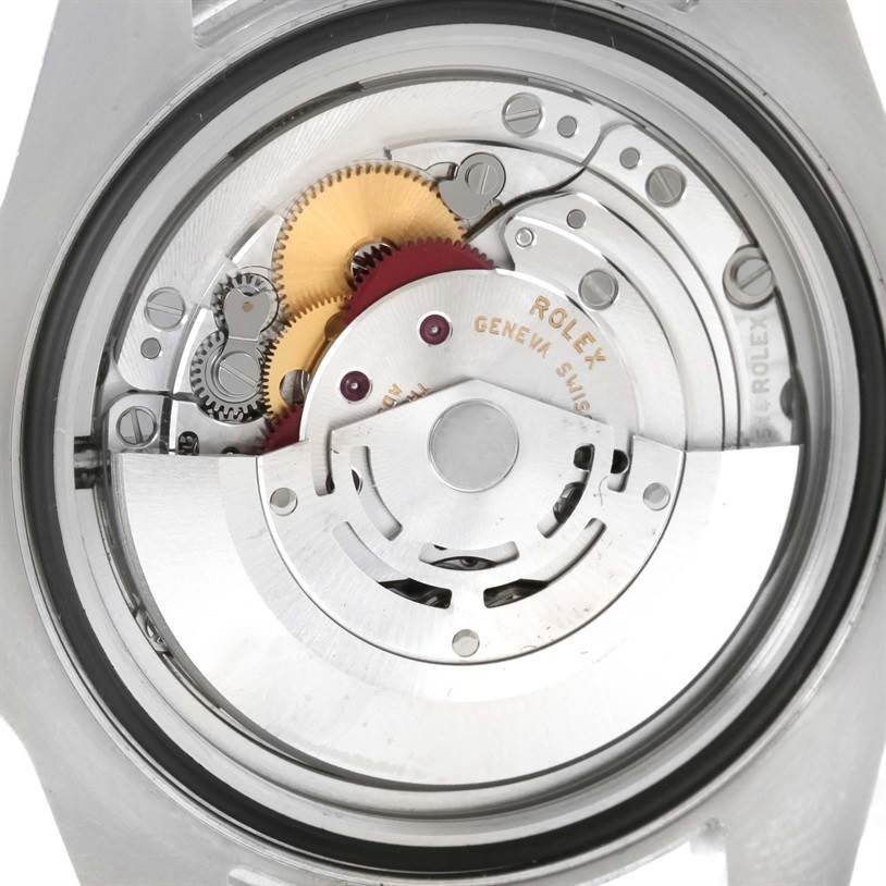 The image shows a close-up view of the internal movement mechanism of a Rolex Submariner 116610LN Men
s Stainless Steel Black Dial 116610LN Men
s Stainless Steel Black Dial watch.