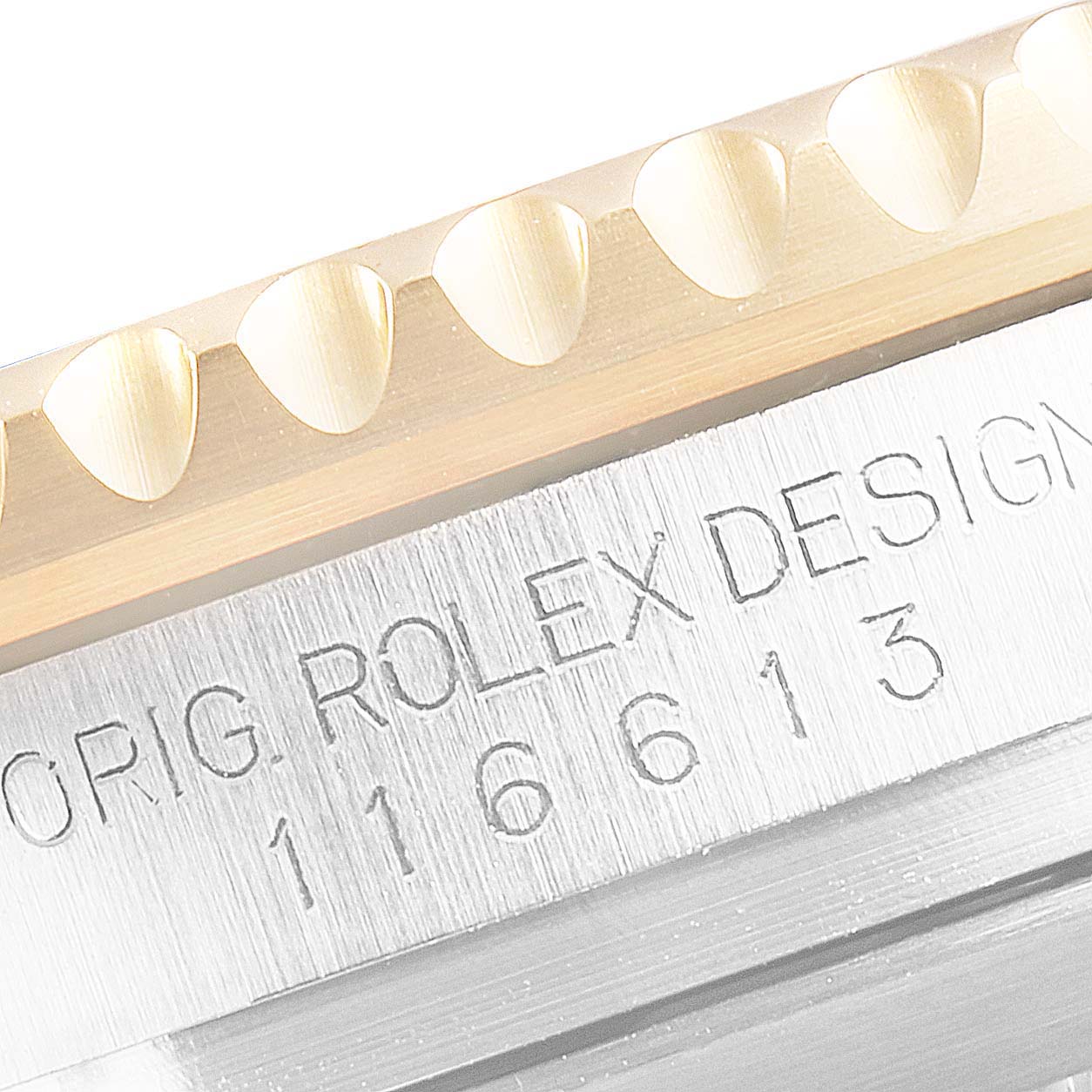 This is a close-up of the side view of a Rolex Submariner 116613LN Men's Steel and Gold (two tone) Black Dial 116613LN Men's Steel and Gold (two tone) Black Dial watch, showing the bezel and model number.