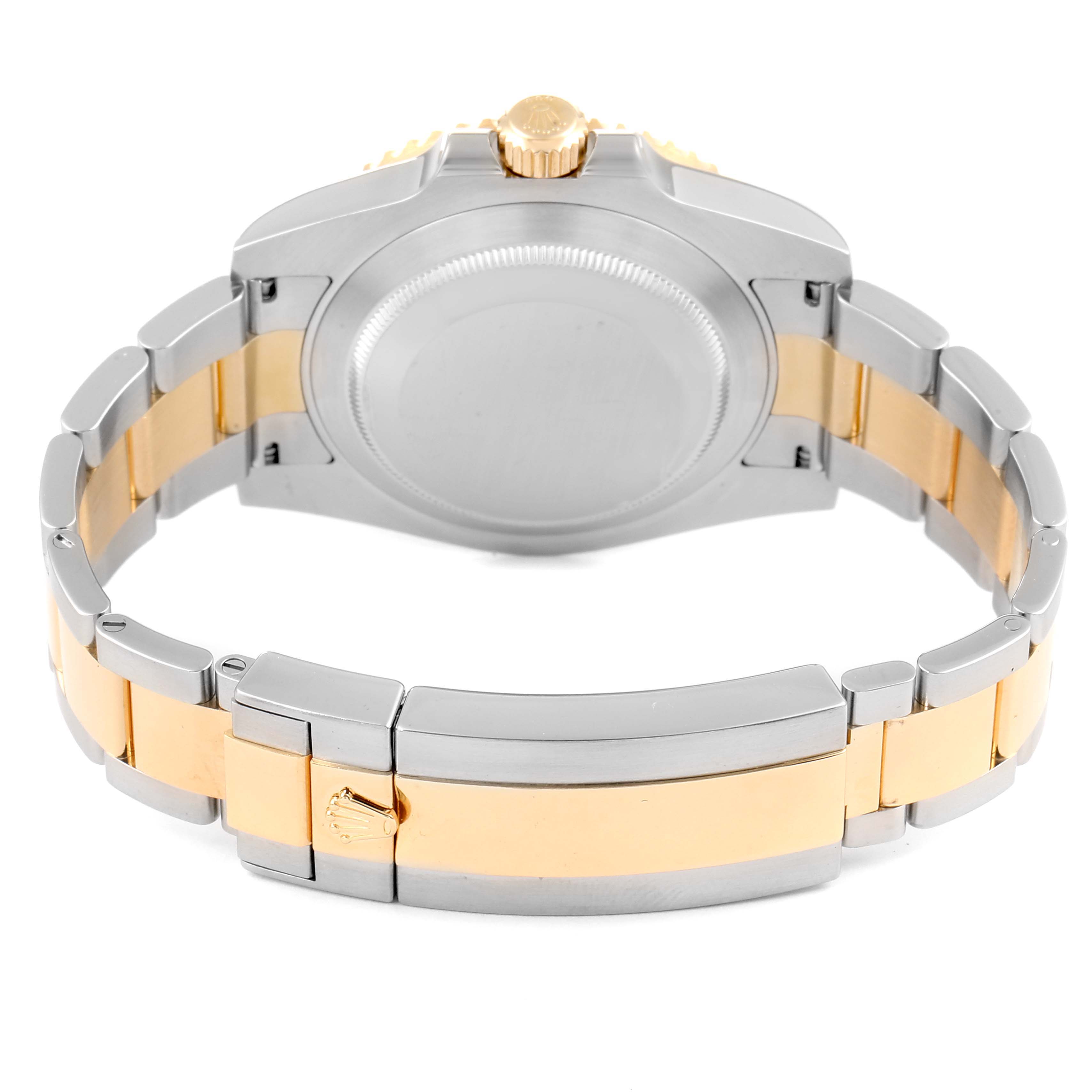 This image shows the back and clasp portion of a Rolex Submariner 116613LN Men's Steel and Gold (two tone) Black Dial 116613LN Men's Steel and Gold (two tone) Black Dial, focusing on the bracelet and watch case.