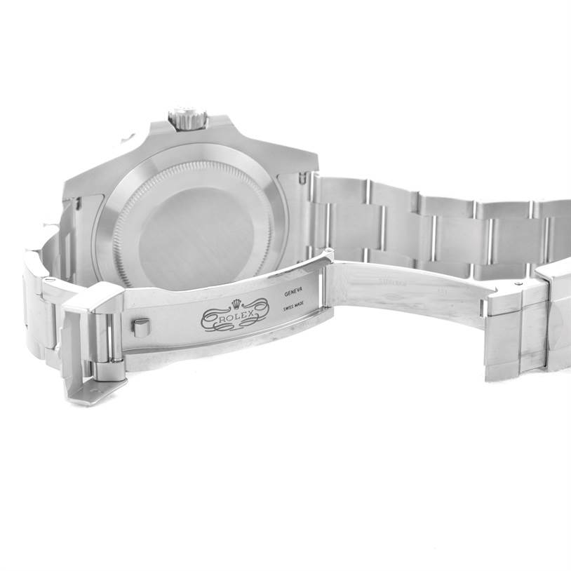 This image shows the back of a Rolex Submariner 116610LV Men's Stainless Steel Green Dial 116610LV Men's Stainless Steel Green Dial watch, highlighting its caseback and partially opened metal bracelet clasp.