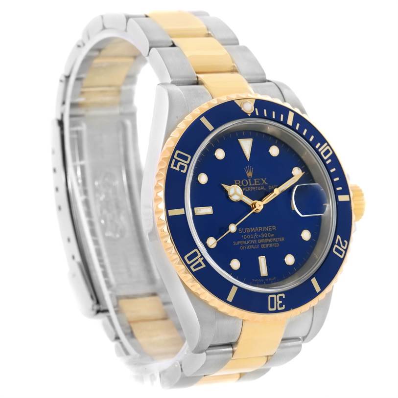 This image shows a Rolex Submariner 16613 Men's Steel and Gold (two tone) Blue Dial 16613 Men's Steel and Gold (two tone) Blue Dial watch at an angle highlighting its blue dial, bezel, and two-tone metal bracelet.
