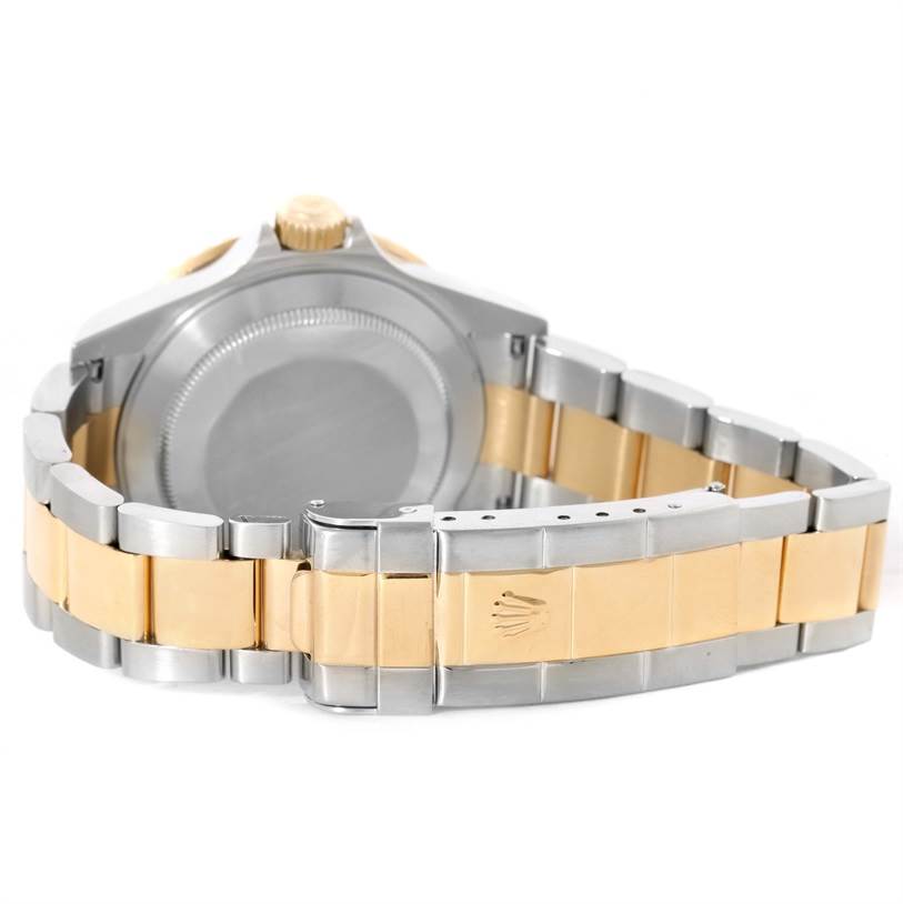 The image shows the back view of a Rolex Submariner 16613 Men's Steel and Gold (two tone) Blue Dial 16613 Men's Steel and Gold (two tone) Blue Dial, highlighting the clasp and bracelet.