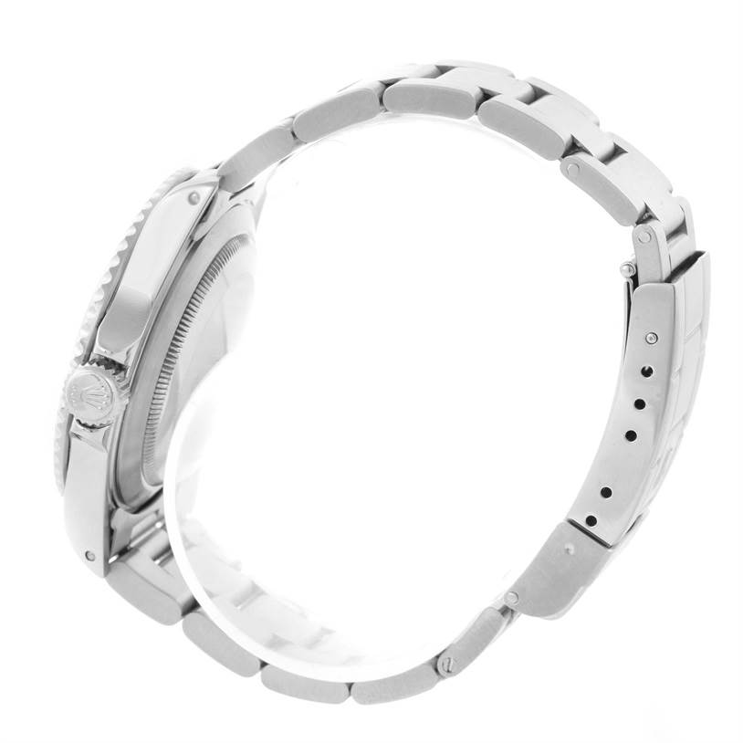 The image shows a side view of the Rolex Submariner 14060 Men
s Stainless Steel Black Dial 14060 Men
s Stainless Steel Black Dial watch, focusing on its bracelet, case, and crown.