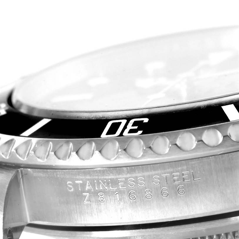 This image shows a close-up of the bezel and case side of a Rolex Submariner 14060 Men
s Stainless Steel Black Dial 14060 Men
s Stainless Steel Black Dial watch, featuring its model and stainless steel material engraving.
