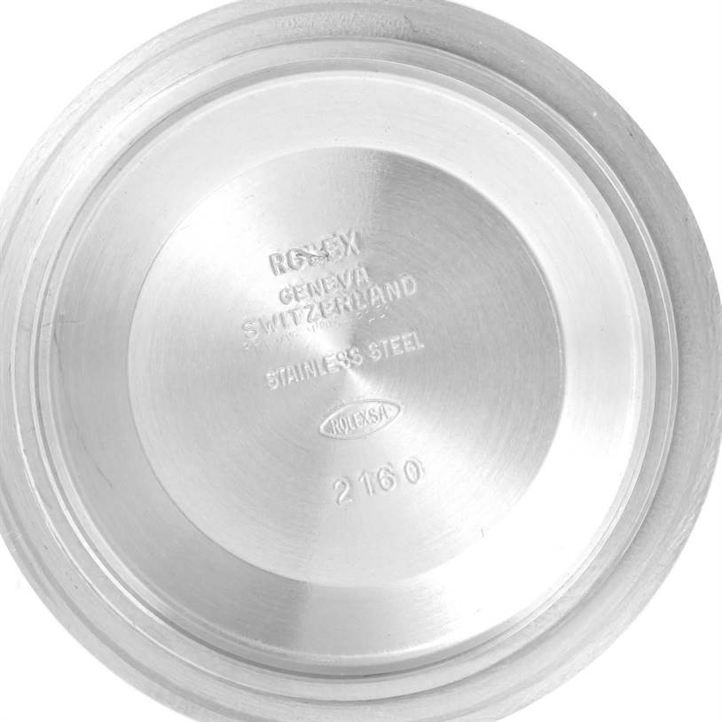 The image shows the inside view of the case back of a Rolex Submariner 14060 Men
s Stainless Steel Black Dial 14060 Men
s Stainless Steel Black Dial, displaying engraving details.