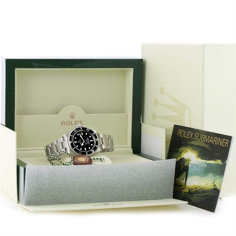 The Rolex Submariner 14060 Men
s Stainless Steel Black Dial 14060 Men
s Stainless Steel Black Dial watch is shown front-facing inside its open box with an accessory booklet.