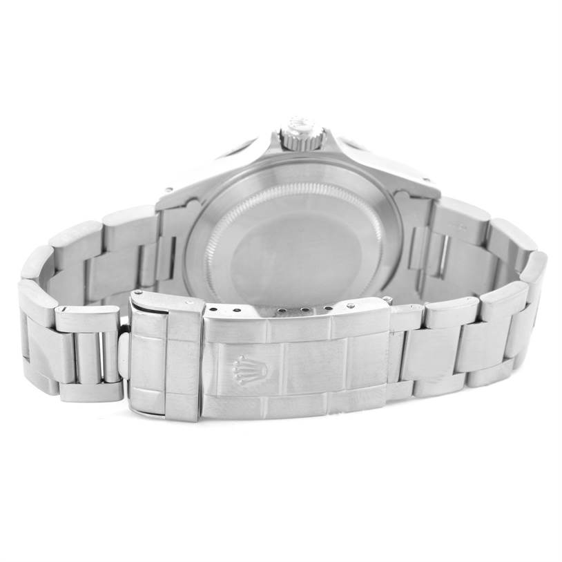 The image shows the back case and metal bracelet of a Rolex Submariner 14060 Men
s Stainless Steel Black Dial 14060 Men
s Stainless Steel Black Dial watch.