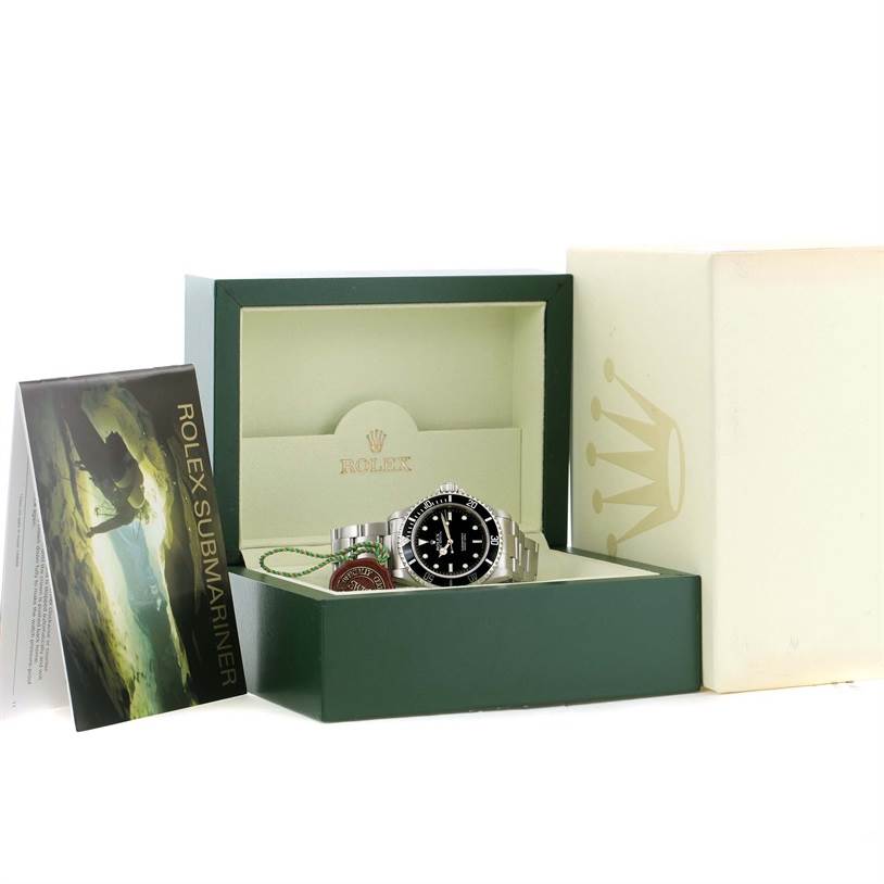 The image shows the Rolex Submariner 14060 Men
s Stainless Steel Black Dial 14060 Men
s Stainless Steel Black Dial watch from a front angle with its box, manual, and tags.