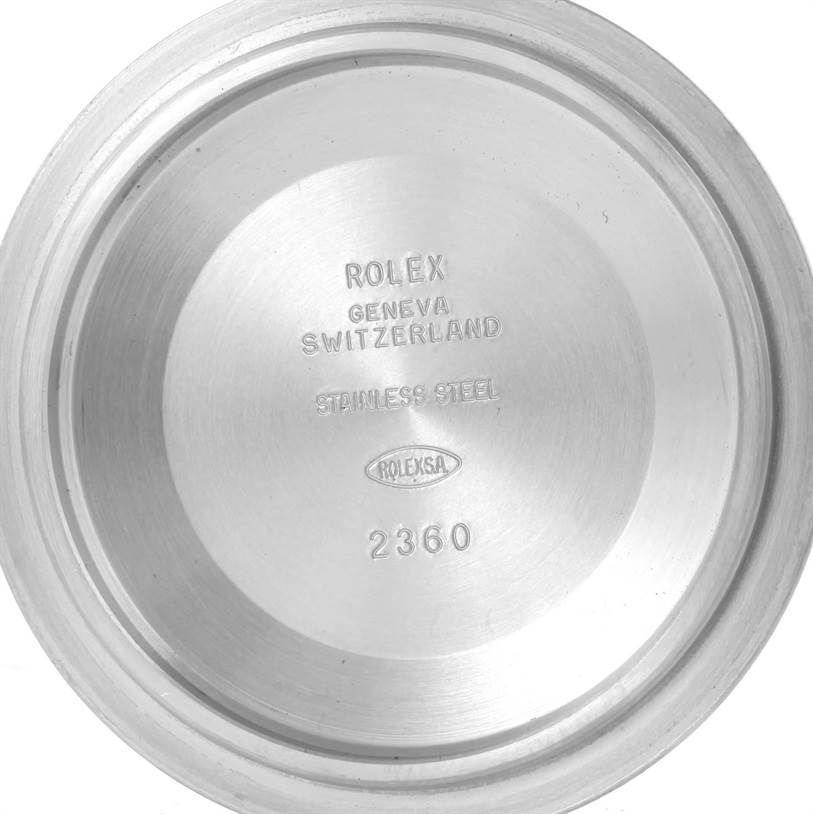 The image shows the back cover of a Rolex Submariner 116610LN Men
s Stainless Steel Black Dial 116610LN Men
s Stainless Steel Black Dial watch, displaying engraved text and markings.