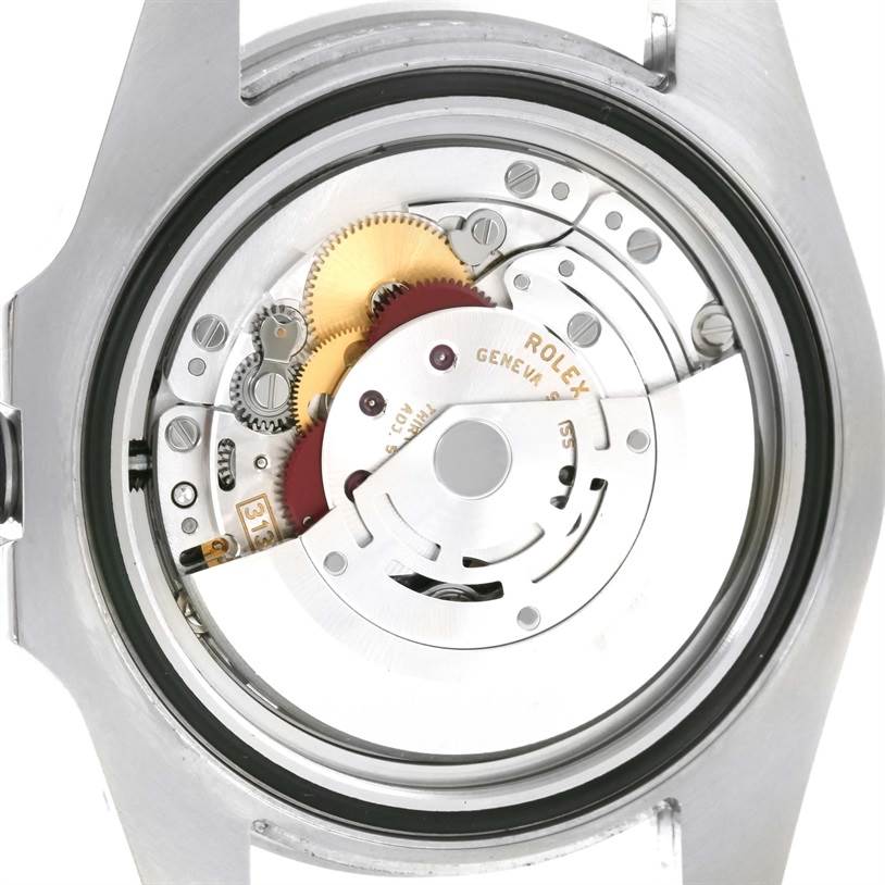 The image shows a close-up view of the internal mechanism of a Rolex Submariner 116610LN Men
s Stainless Steel Black Dial 116610LN Men
s Stainless Steel Black Dial watch, focusing on the intricate gears and components.