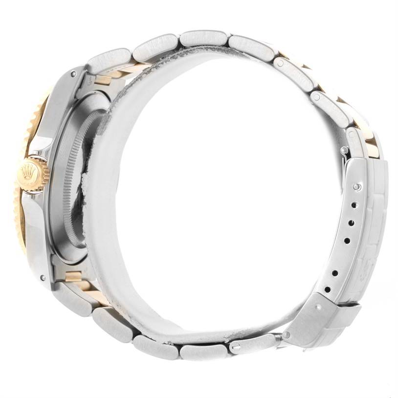 The image shows a side view of a Rolex Submariner 16613 Men's Steel and Gold (two tone) Blue Dial 16613 Men's Steel and Gold (two tone) Blue Dial watch, highlighting the case, crown, and partially the bracelet.