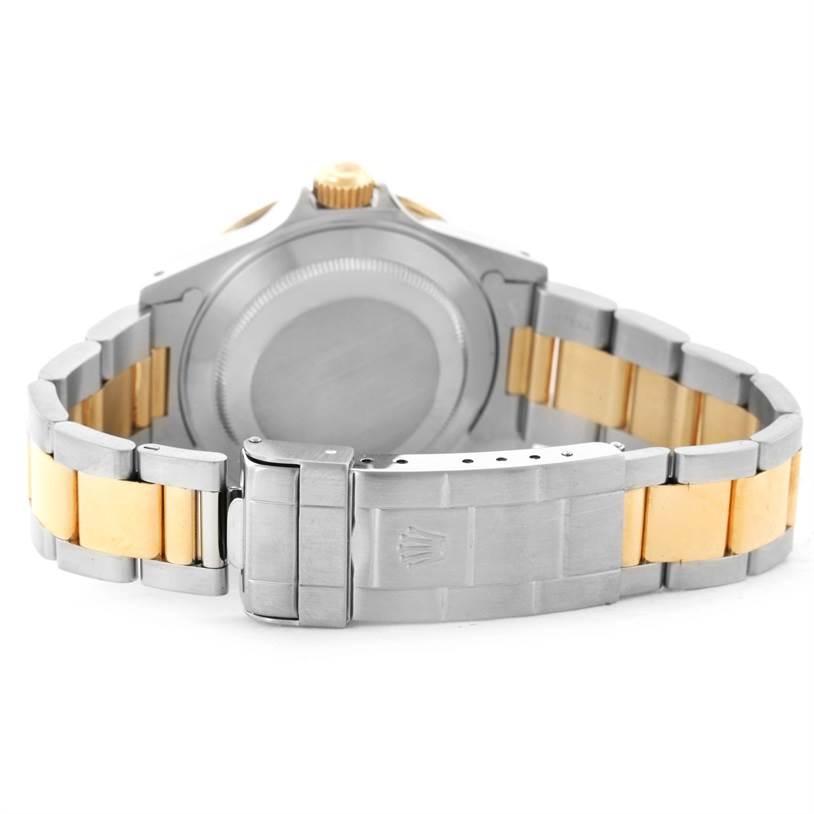 The image shows the back case and bracelet of a Rolex Submariner 16613 Men's Steel and Gold (two tone) Blue Dial 16613 Men's Steel and Gold (two tone) Blue Dial watch.