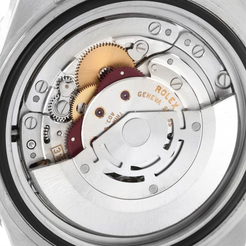 The image shows the backside of the Rolex Submariner 16610 Men
s Stainless Steel Black Dial 16610 Men
s Stainless Steel Black Dial watch, revealing its inner mechanical movement and components.