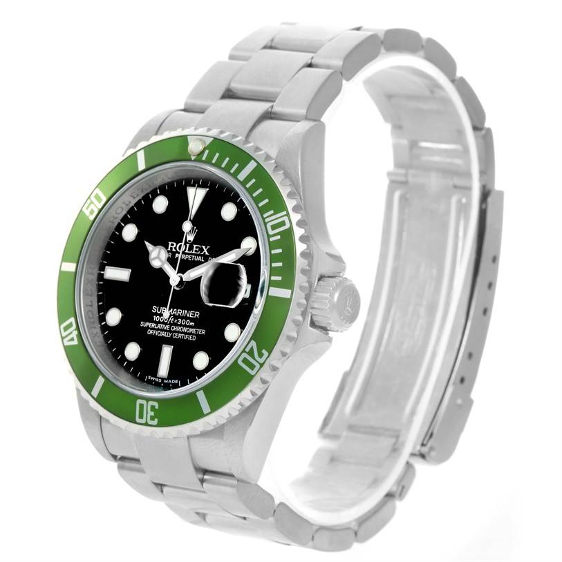 The image shows a Rolex Submariner 16610LV Men
s Stainless Steel Black Dial 16610LV Men
s Stainless Steel Black Dial watch at an angled side view, highlighting its green bezel, black dial, and metal bracelet.