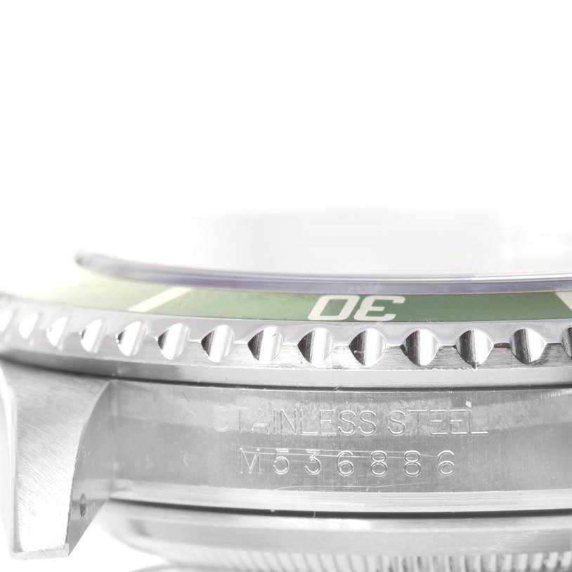 This image shows a close-up side view of the bezel and serial number on the case of a Rolex Submariner 16610LV Men
s Stainless Steel Black Dial 16610LV Men
s Stainless Steel Black Dial watch.