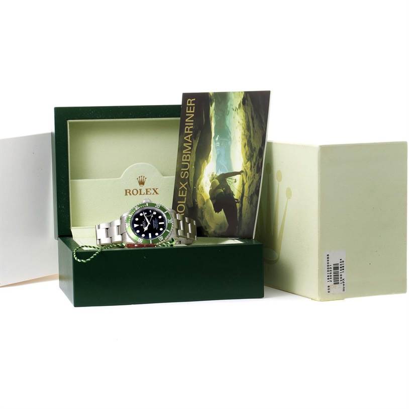 The Rolex Submariner 16610LV Men
s Stainless Steel Black Dial 16610LV Men
s Stainless Steel Black Dial watch is shown from a frontal angle inside its open box, accompanied by a brochure and box cover.