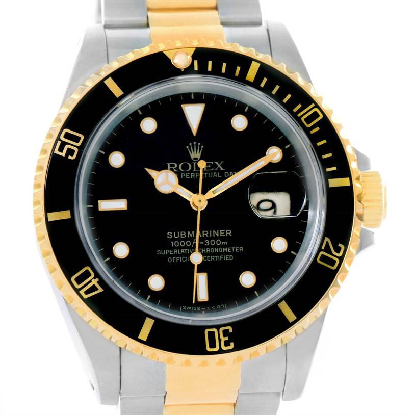 This image shows a frontal view of the Rolex Submariner 16613 Men's Steel and Gold (two tone) Black Dial 16613 Men's Steel and Gold (two tone) Black Dial watch, highlighting its black dial, gold accents, and magnified date window.