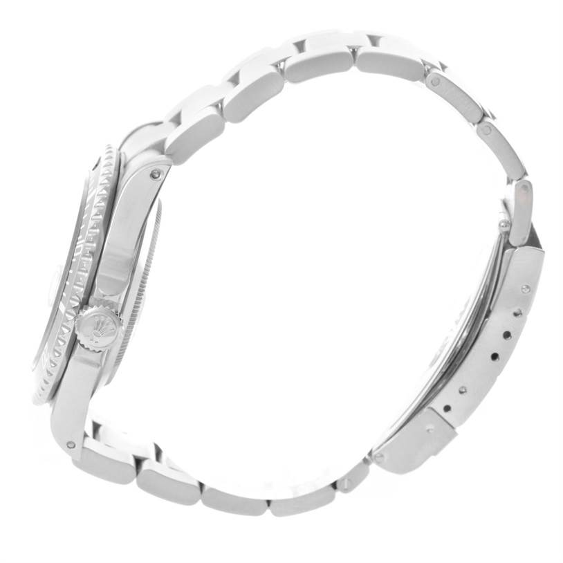 The image shows a side view of a Rolex Submariner 16610 Men
s Stainless Steel Black Dial 16610 Men
s Stainless Steel Black Dial watch, highlighting the case, crown, bezel, and bracelet links.