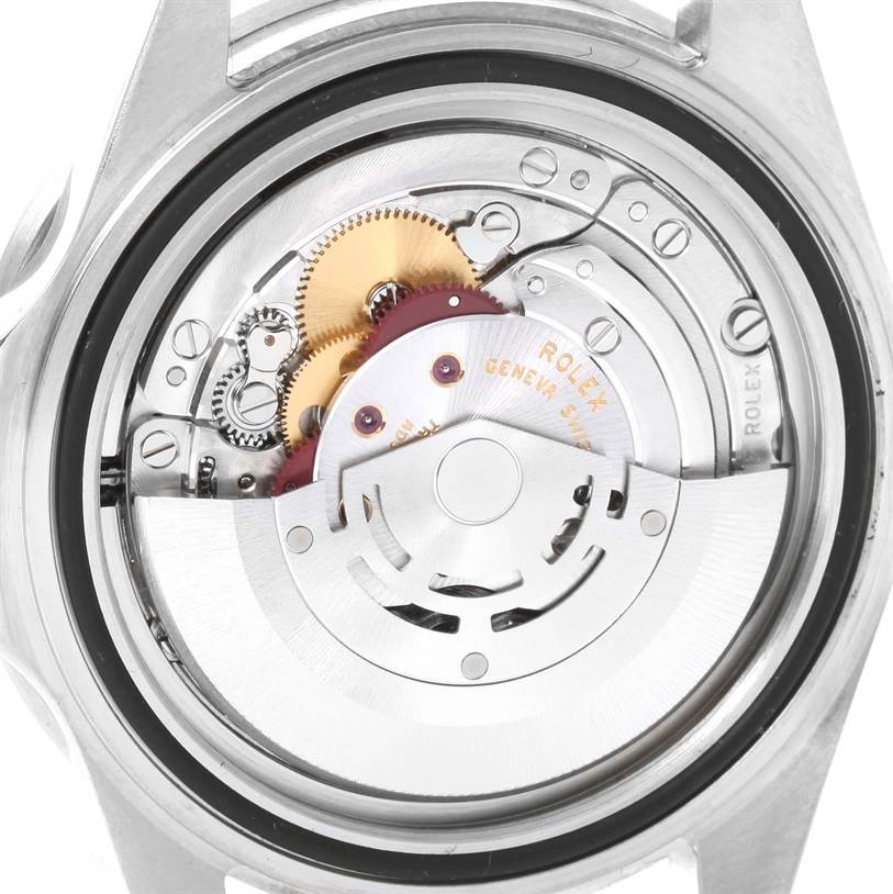 The image shows the internal movement mechanism of a Rolex Submariner 16610LV Men
s Stainless Steel Black Dial 16610LV Men
s Stainless Steel Black Dial watch from a rear angle.