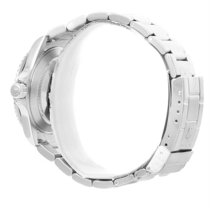 The image shows a side view of a Rolex Submariner 16610LV Men
s Stainless Steel Black Dial 16610LV Men
s Stainless Steel Black Dial, highlighting the bracelet, clasp, and part of the watch case.