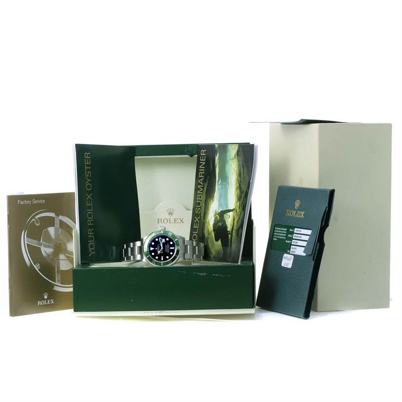 The image shows a Rolex Submariner 16610LV Men
s Stainless Steel Black Dial 16610LV Men
s Stainless Steel Black Dial watch with its box, manuals, and warranty card displayed together.