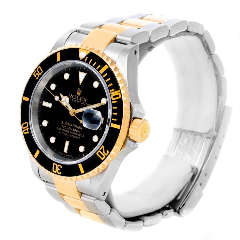 The Rolex Submariner 16613 Men
s Steel and Gold (two tone) Black Dial 16613 Men
s Steel and Gold (two tone) Black Dial watch is shown at a three-quarter angle featuring its bezel, dial, and two-tone bracelet.