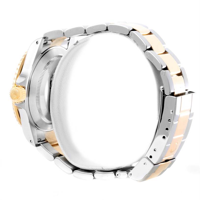 This image shows a side view of a Rolex Submariner 16613 Men
s Steel and Gold (two tone) Black Dial 16613 Men
s Steel and Gold (two tone) Black Dial watch, highlighting the bracelet, crown, and case back.