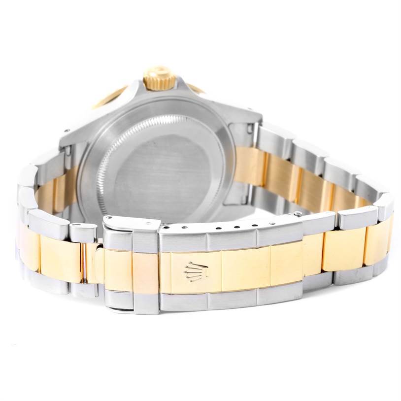 This image shows the back case and bracelet of a Rolex Submariner 16613 Men
s Steel and Gold (two tone) Black Dial 16613 Men
s Steel and Gold (two tone) Black Dial, highlighting the two-tone metal links and clasp.