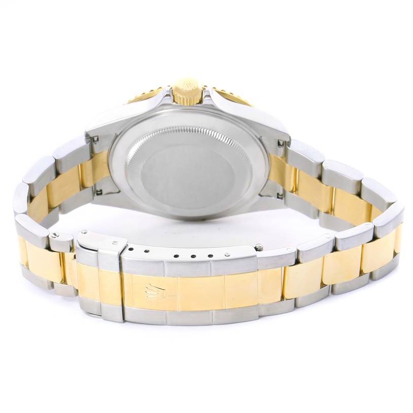 The image shows the back case, crown, and bracelet of a Rolex Submariner 16613 Men's Steel and Gold (two tone) Grey Dial 16613 Men's Steel and Gold (two tone) Grey Dial watch from the rear angle.