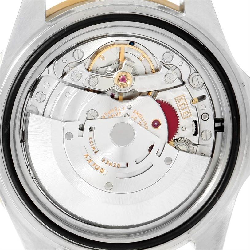 The image shows a close-up view of the Rolex Submariner 16613 Men's Steel and Gold (two tone) Grey Dial 16613 Men's Steel and Gold (two tone) Grey Dial's movement mechanism from the back.