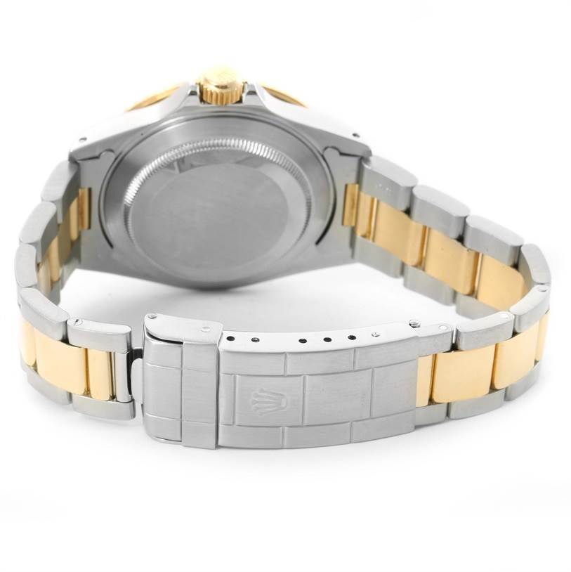 The image shows the back case, bracelet, and clasp of a Rolex Submariner 16613 Men's Steel and Gold (two tone) Blue Dial 16613 Men's Steel and Gold (two tone) Blue Dial watch.