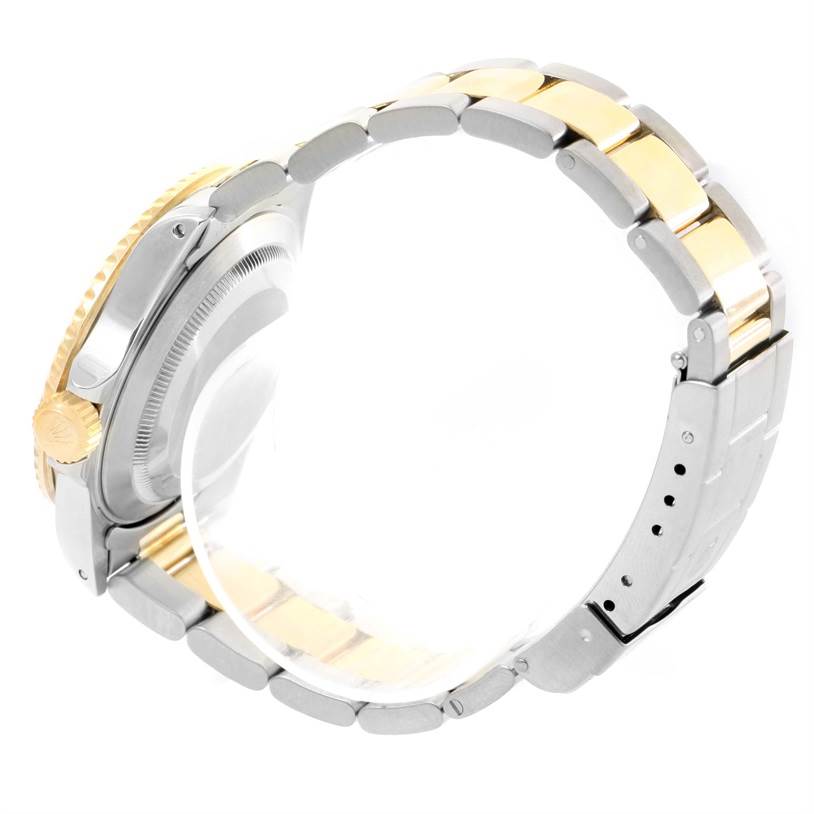 The image shows a side view of the bracelet, case, and crown of a Rolex Submariner 16613 Men's Steel and Gold (two tone) Blue Dial 16613 Men's Steel and Gold (two tone) Blue Dial watch.