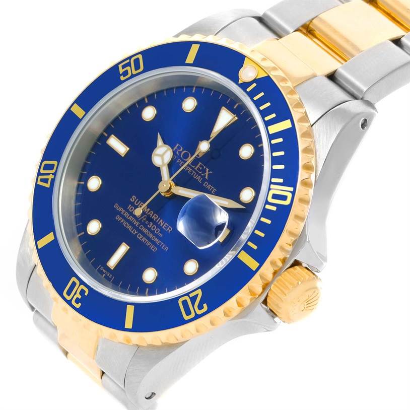 The image shows a Rolex Submariner 16613 Men's Steel and Gold (two tone) Blue Dial 16613 Men's Steel and Gold (two tone) Blue Dial watch at an angle, highlighting the blue watch face, bezel, and part of the bracelet.