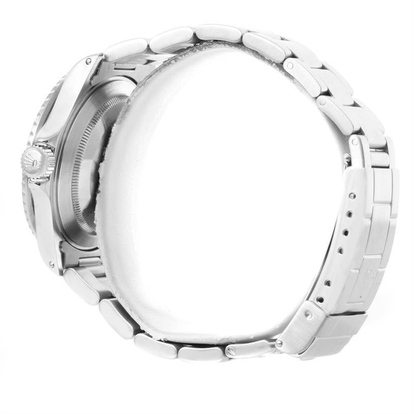 The image shows a side profile of a Rolex Submariner 16610 Men
s Stainless Steel Black Dial 16610 Men
s Stainless Steel Black Dial watch, highlighting its case, crown, and bracelet.