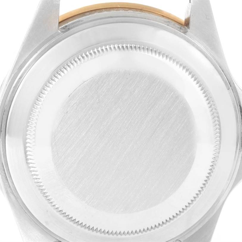 The image shows the back case of a Rolex Submariner 16613 Men
s Steel and Gold (two tone) Black Dial 16613 Men
s Steel and Gold (two tone) Black Dial watch from a top-down angle.