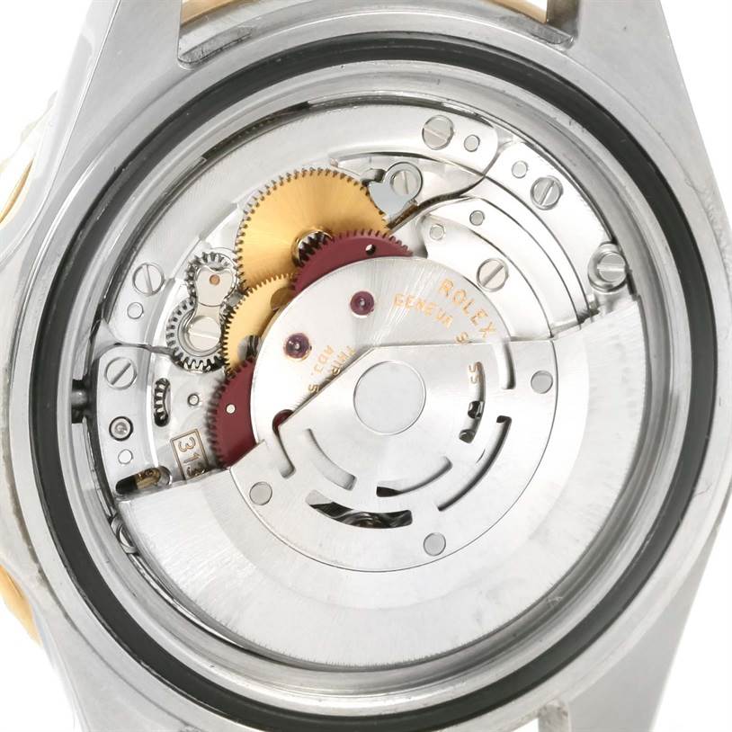 This image shows the internal movement mechanism of a Rolex Submariner 16613 Men
s Steel and Gold (two tone) Black Dial 16613 Men
s Steel and Gold (two tone) Black Dial watch from a back angle.