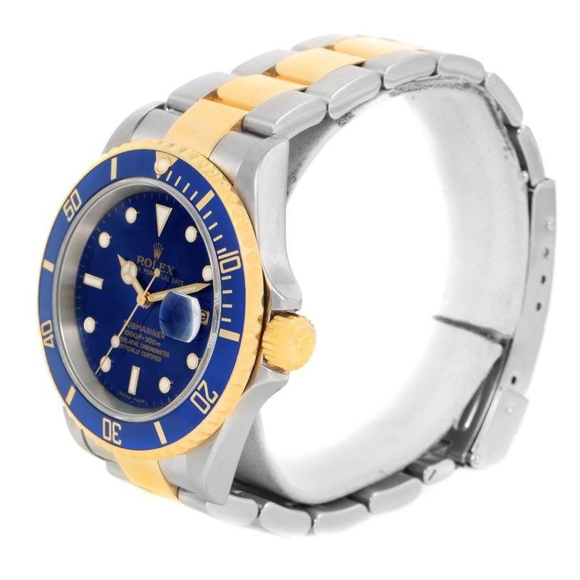 This image shows a Rolex Submariner 16613 Men
s Steel and Gold (two tone) Black Dial 16613 Men
s Steel and Gold (two tone) Black Dial watch at a three-quarter angle, highlighting its blue dial, bezel, and two-tone bracelet.