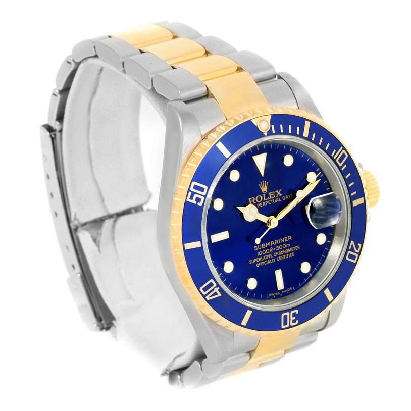 The image shows a Rolex Submariner 16613 Men
s Steel and Gold (two tone) Black Dial 16613 Men
s Steel and Gold (two tone) Black Dial watch at a 3/4 angle, displaying the face, bezel, crown, and bracelet.