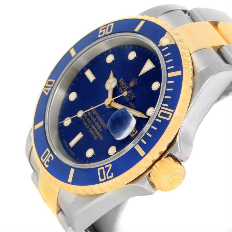 The image shows a close-up, angled view of a Rolex Submariner 16613 Men
s Steel and Gold (two tone) Black Dial 16613 Men
s Steel and Gold (two tone) Black Dial watch displaying the dial, bezel, and crown.
