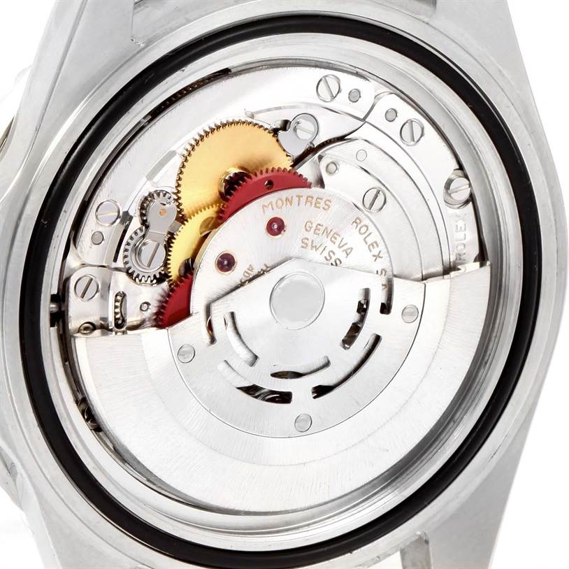 The image shows the Rolex Submariner 16610 Men
s Stainless Steel Black Dial 16610 Men
s Stainless Steel Black Dial
s movement with its intricate gears and inner components, viewed from the back.