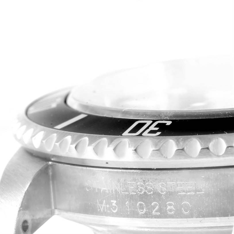 This image shows a close-up of the bezel and side of the case of a Rolex Submariner 16610 Men
s Stainless Steel Black Dial 16610 Men
s Stainless Steel Black Dial watch.